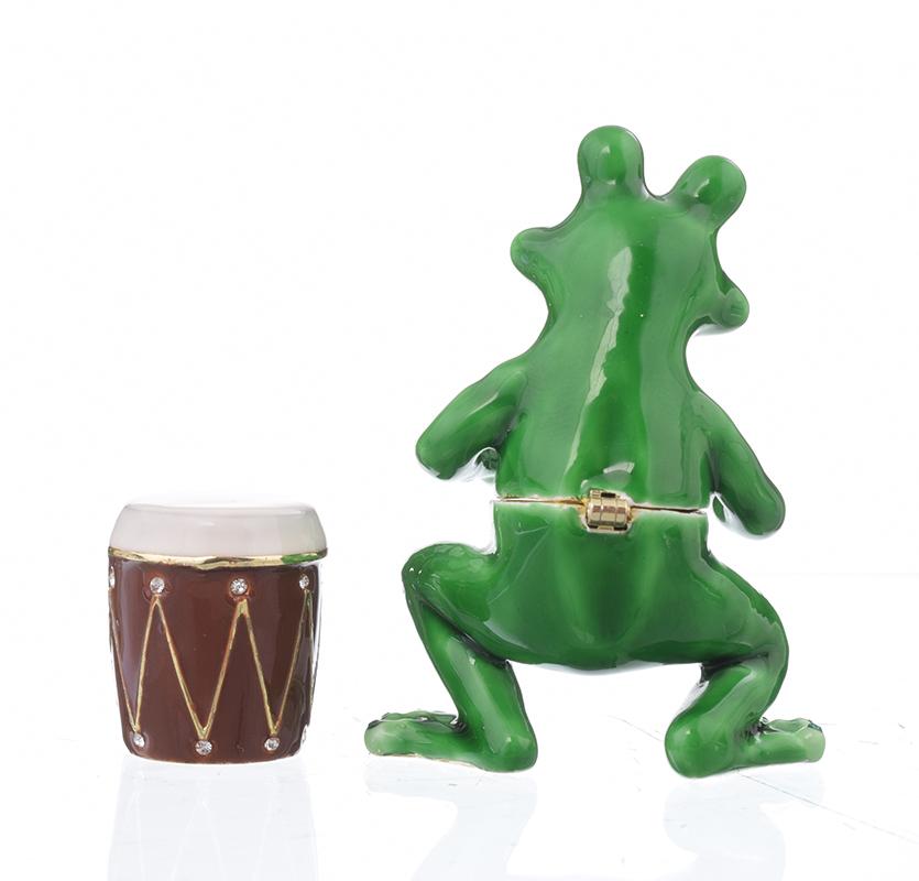 A beautifully crafted Frog Playing Drums jewelry box, featuring vibrant enamel and sparkling Austrian crystals, handmade by Keren Kopal.