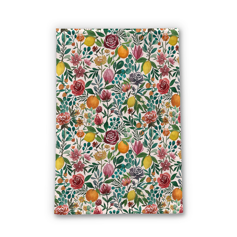 A colorful Fruit and Flowers Tea Towel made of cotton twill, featuring vibrant floral and fruit designs, perfect for kitchen use.