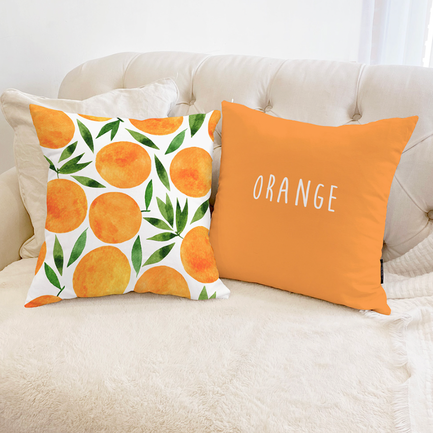 A vibrant orange fruits design cushion showcasing a double-sided pattern, made from high-quality microfiber with a polyester insert.