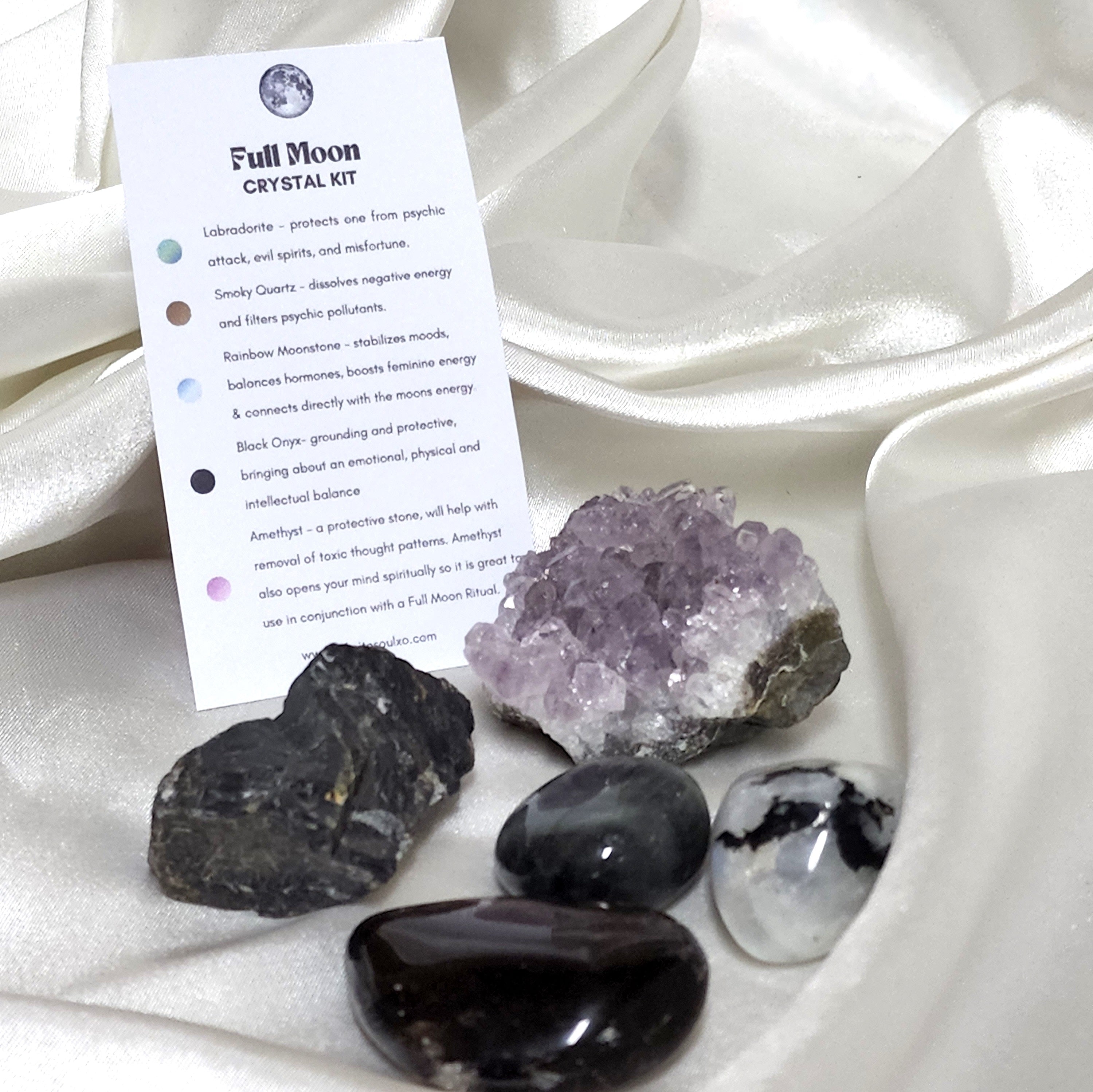 Full Moon Crystal Kit featuring Smoky Quartz, Black Onyx, Amethyst, Rainbow Moonstone, and Labradorite, arranged aesthetically.