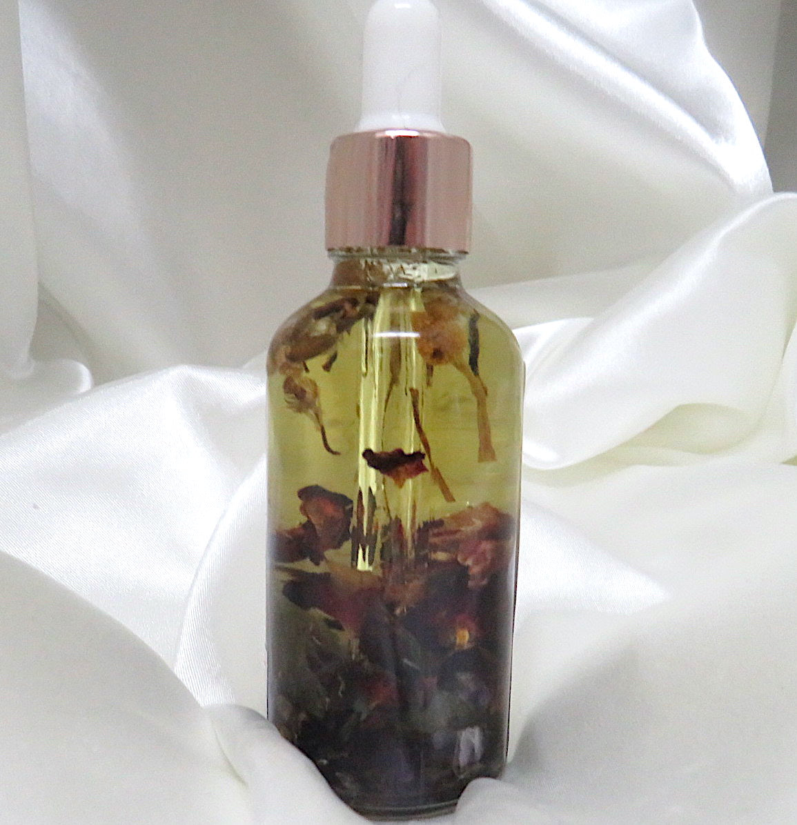 Full Moon Goddess Body and Perfume Oil bottle with Lemongrass and Sage scent, featuring crystal chips of Amethyst and Labradorite.