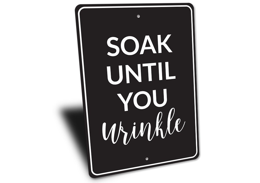 A humorous bathroom sign made of high-quality aluminum, featuring a funny quote, designed for wall decor.