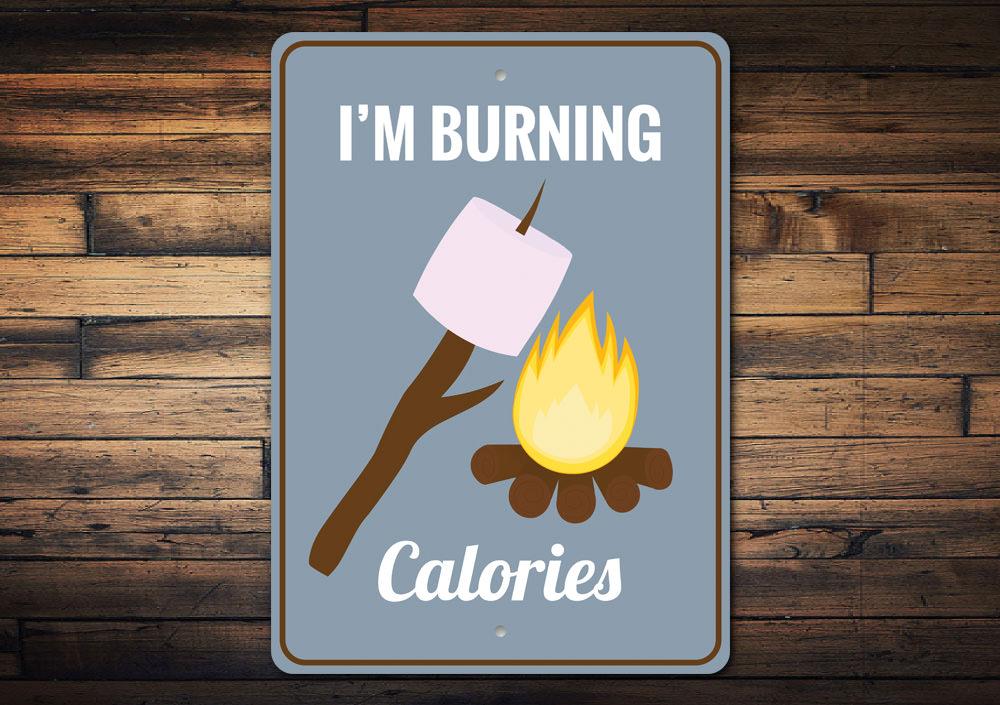 A humorous decorative sign featuring a playful smores design, made from high-quality aluminum, perfect for home decor.