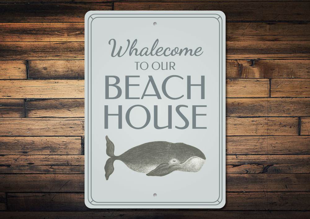 A whimsical Funny Whale Sign made of aluminum, featuring a playful whale design, perfect for beach-themed decor.