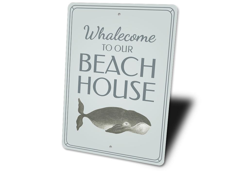 A whimsical Funny Whale Sign made of aluminum, featuring a playful whale design, perfect for beach-themed decor.