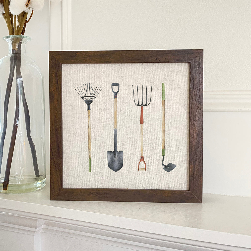 A beautifully framed garden tools sign with a natural wood frame and linen-look background, perfect for home or garden decor.