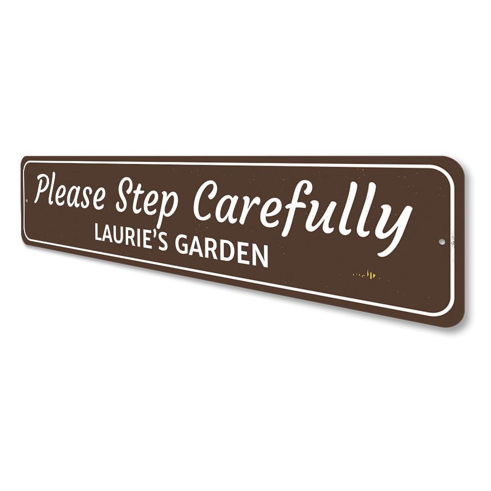 A customizable Garden Warning Sign made of durable aluminum, featuring pre-drilled holes for easy mounting, displayed in a garden setting.