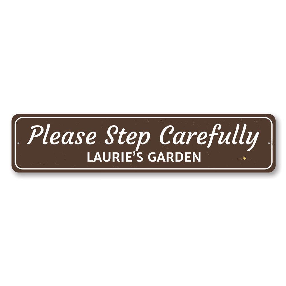 A customizable Garden Warning Sign made of durable aluminum, featuring pre-drilled holes for easy mounting, displayed in a garden setting.