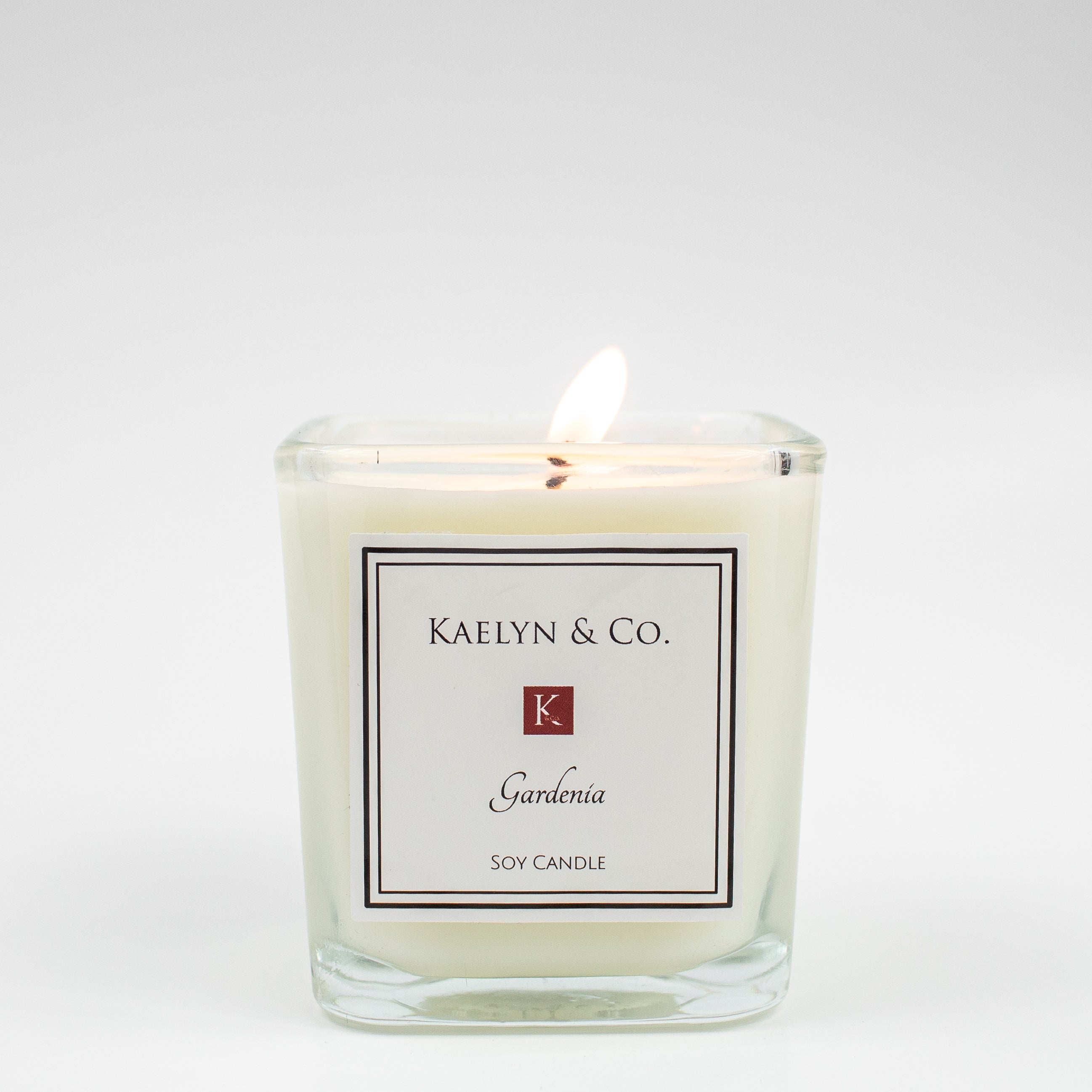 Gardenia Small Cube Candle in elegant packaging, showcasing its soft floral aroma and hand-poured soy wax.