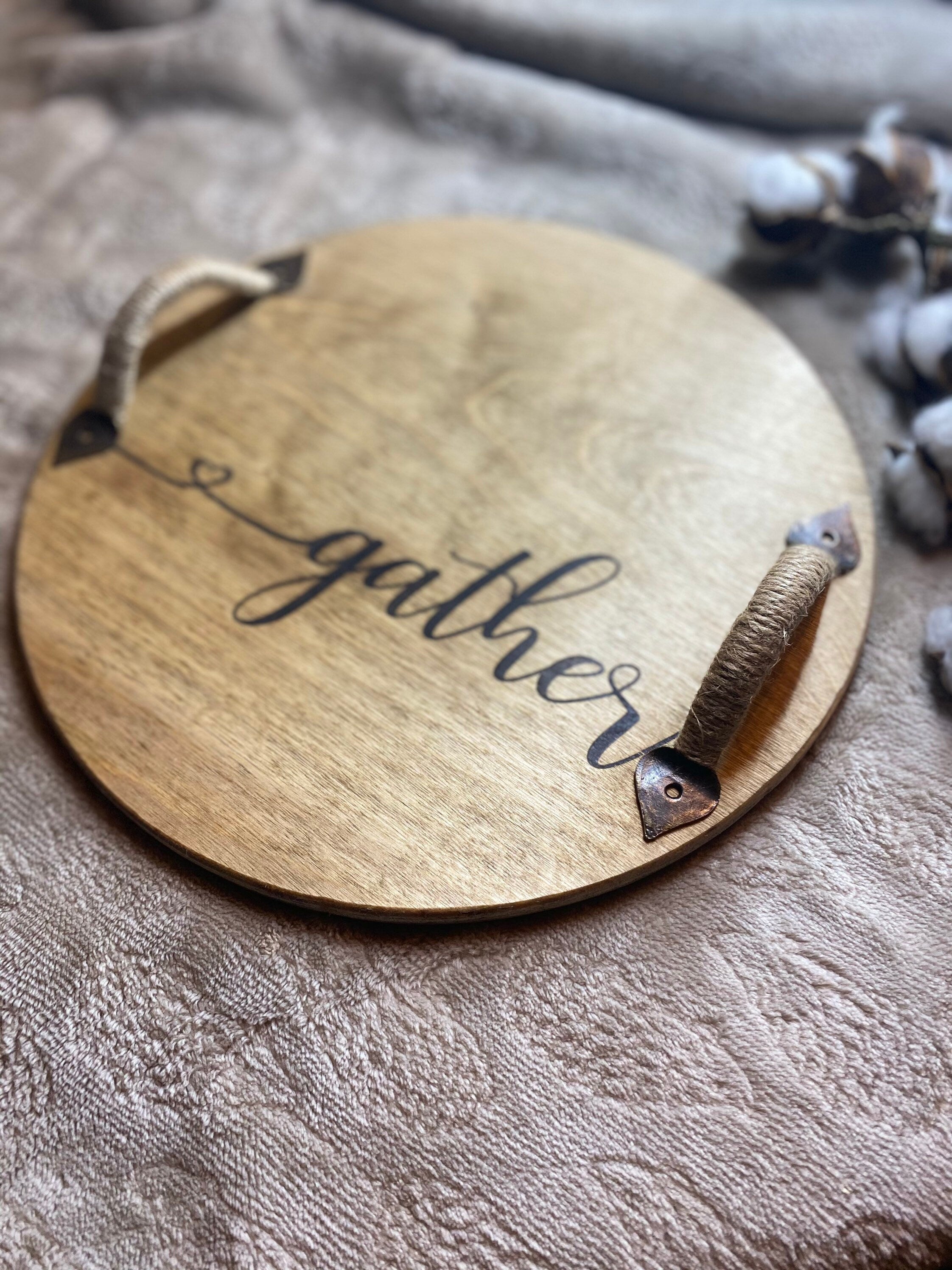 Gather Wooden Serving Tray made of birch plywood with a special walnut stain, featuring black metal handles and unique wood grain patterns.