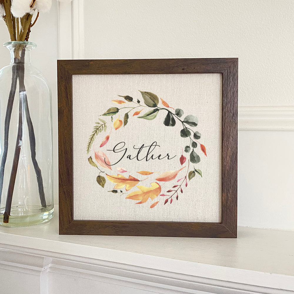 Gather Wreath - Framed Sign featuring a stylized wood frame with a linen-look background, perfect for home decor.