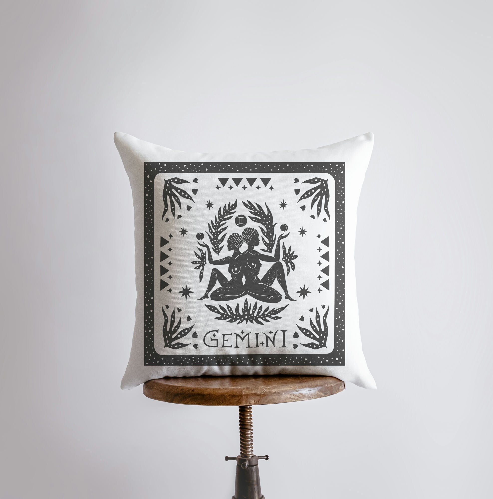 Gemini Zodiac Throw Pillow featuring the Gemini symbol on the front, handcrafted in America with a concealed zipper and available in various sizes.