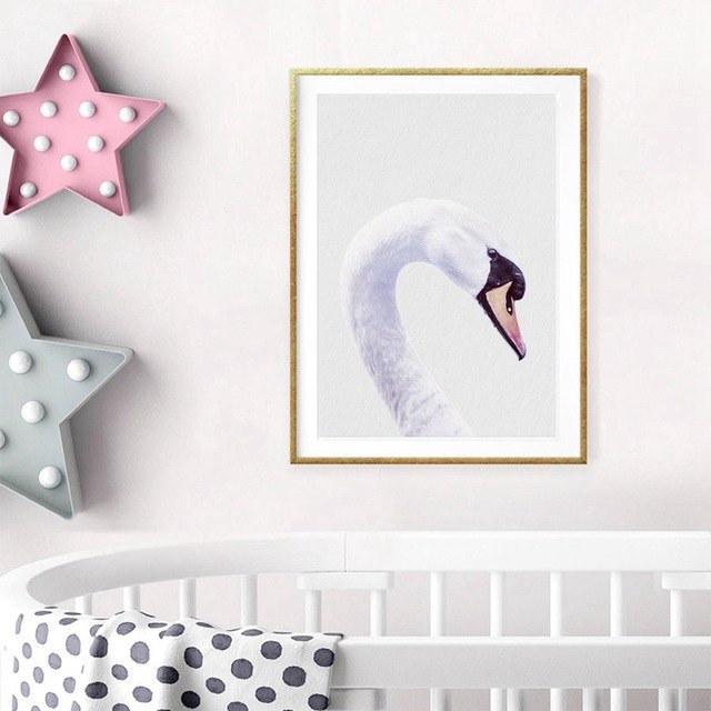 Swan artwork above baby crib