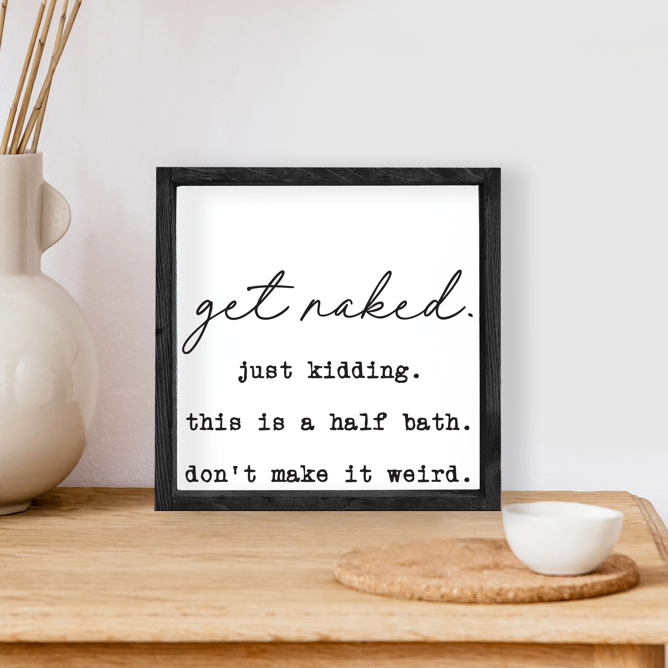 Get Naked, Just Kidding Wood Sign with a humorous message, framed in stained pine wood, perfect for bathroom decor.