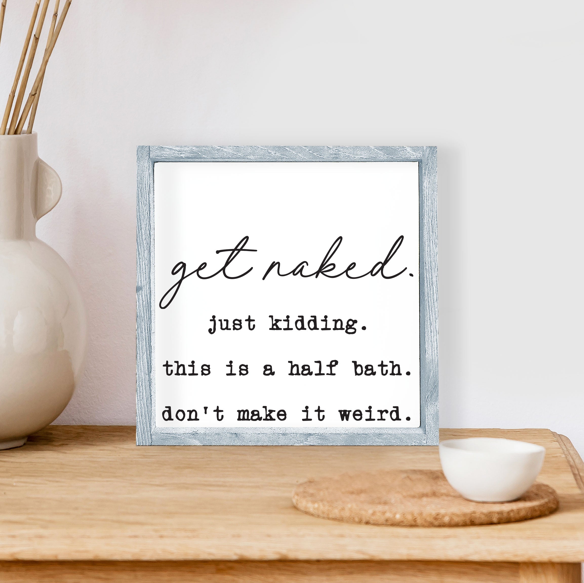 Get Naked, Just Kidding Wood Sign with a humorous message, framed in stained pine wood, perfect for bathroom decor.