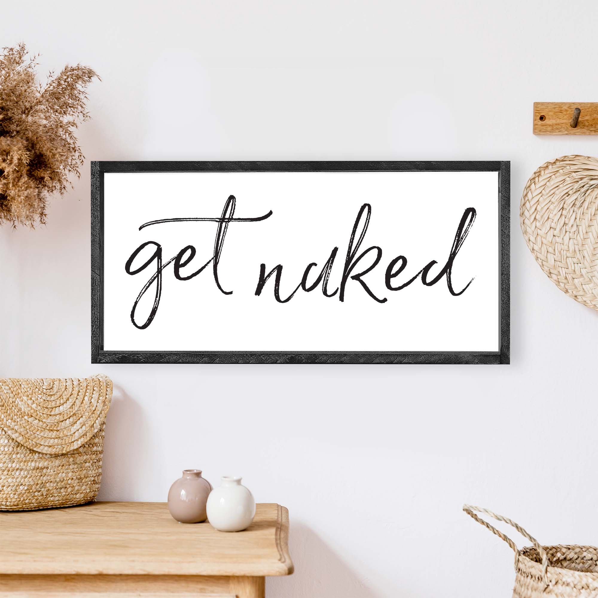 Get Naked Wood Sign with a rustic wood frame, black waterproof text on a white background, handmade in Toronto.