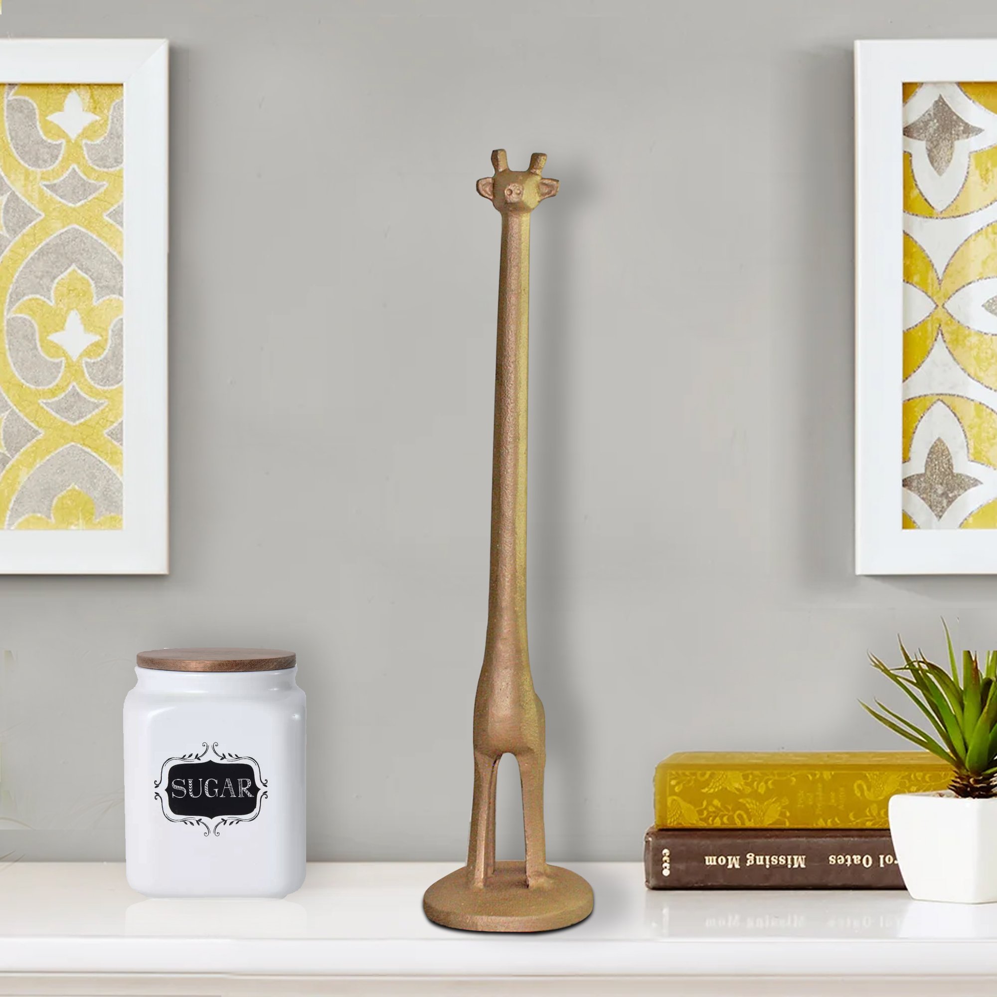 Handmade gold cast iron giraffe paper towel holder, featuring a detailed giraffe design with a tall neck, perfect for kitchen or bathroom use.