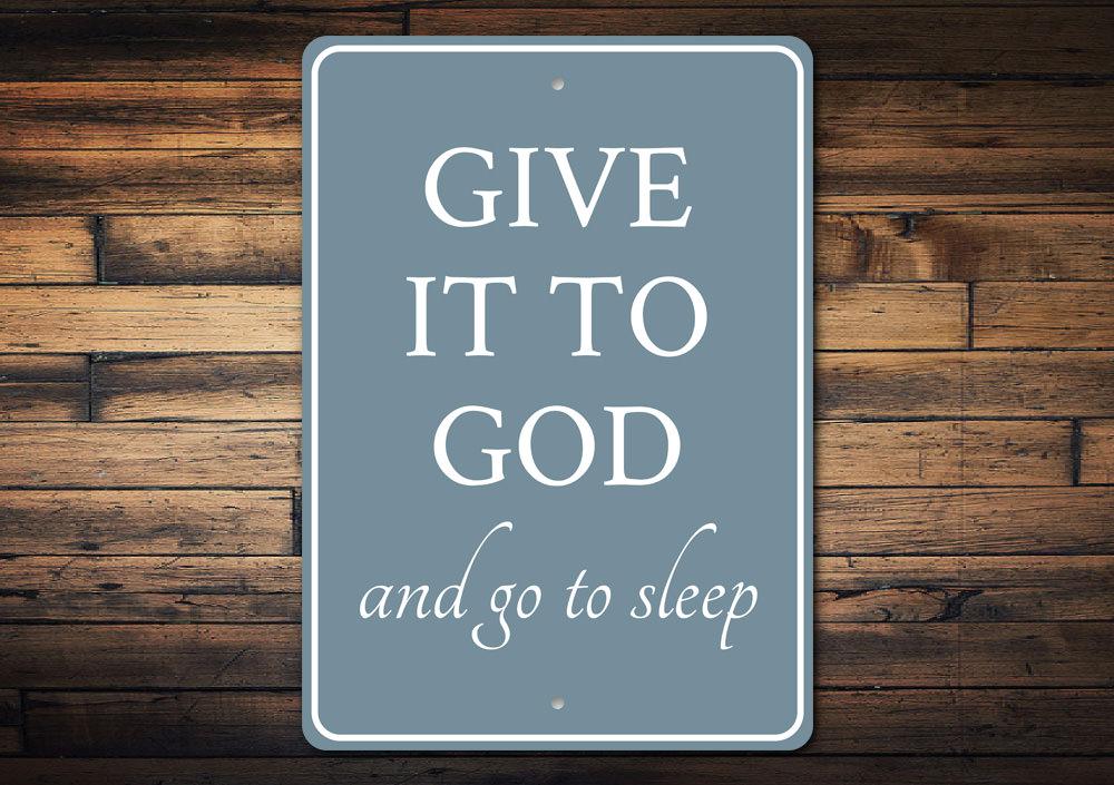 A decorative 'Give it to God' metal sign made from high-quality aluminum, featuring elegant typography and a stylish design suitable for home decor.