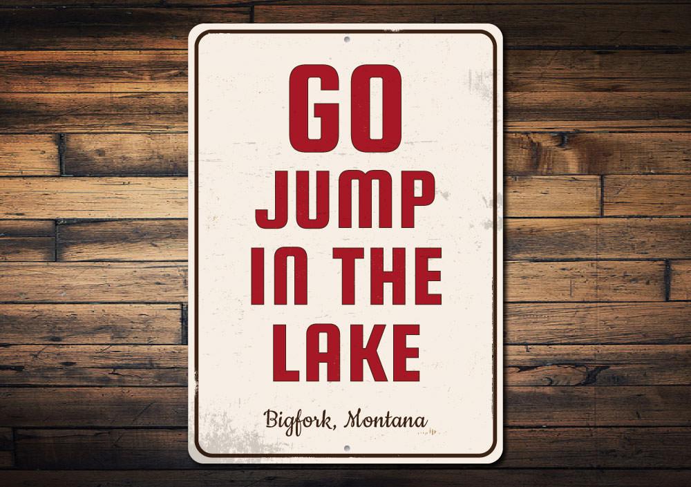 A decorative Go Jump in the Lake sign made of high-quality aluminum, featuring vibrant colors and customizable text, perfect for lakehouse decor.