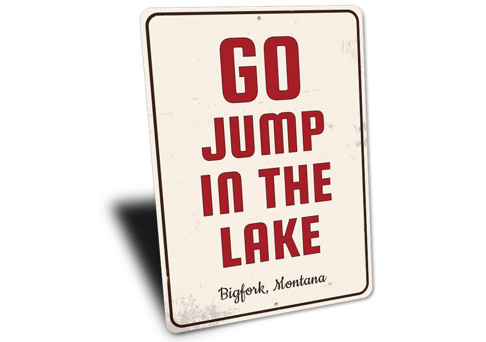 A decorative Go Jump in the Lake sign made of high-quality aluminum, featuring vibrant colors and customizable text, perfect for lakehouse decor.