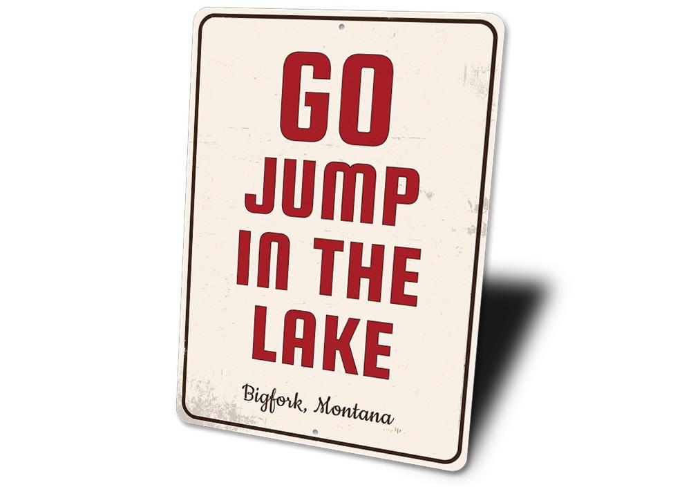 A decorative Go Jump in the Lake sign made of high-quality aluminum, featuring vibrant colors and customizable text, perfect for lakehouse decor.