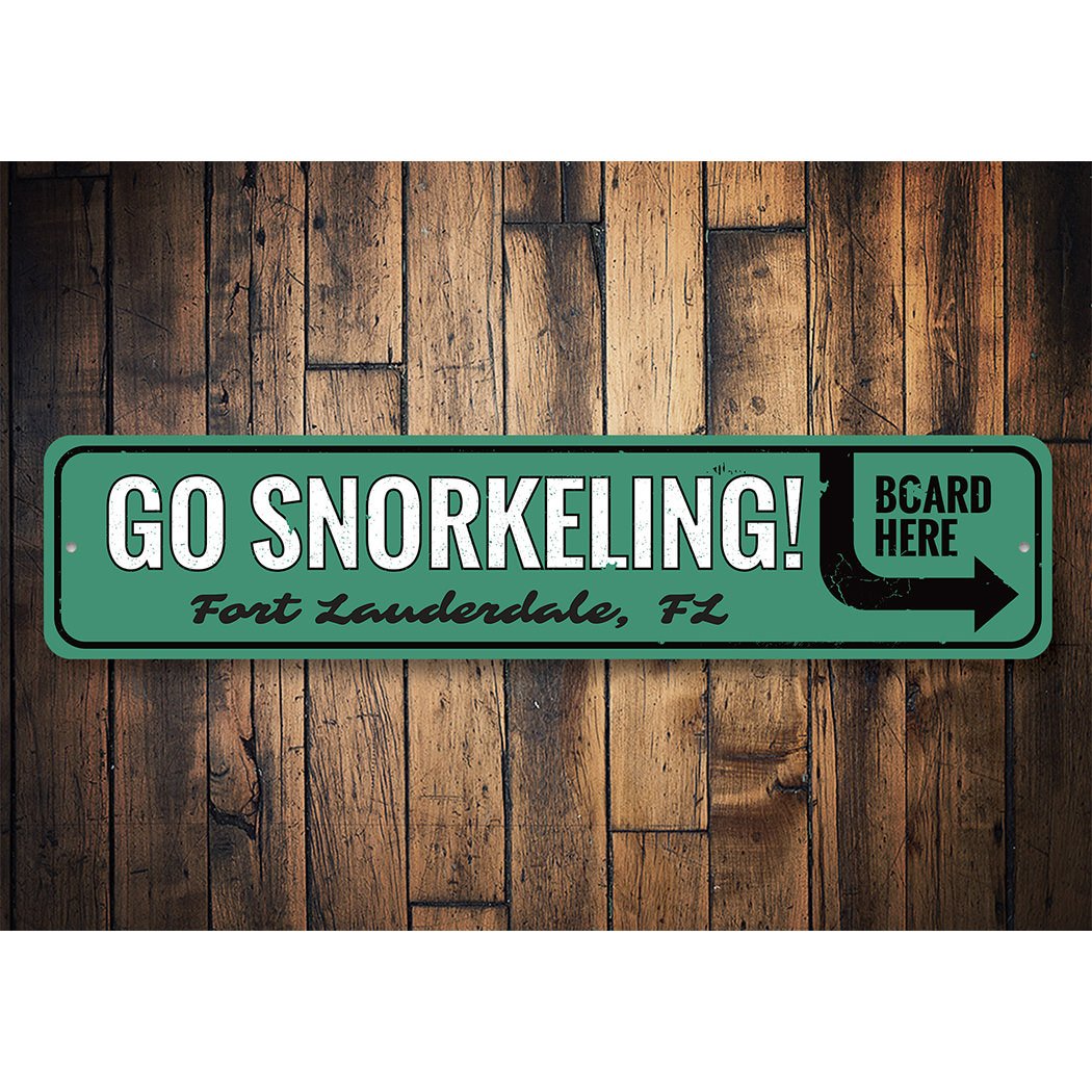 A vibrant Go Snorkeling Sign made of high-quality aluminum, featuring beach-themed graphics, perfect for coastal decor.