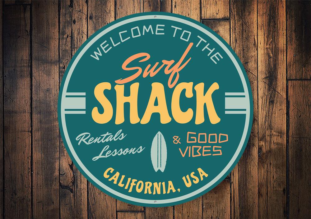 Good Vibes Surf Shack Sign made of durable aluminum, featuring vibrant colors and a beach-themed design, perfect for home decor.