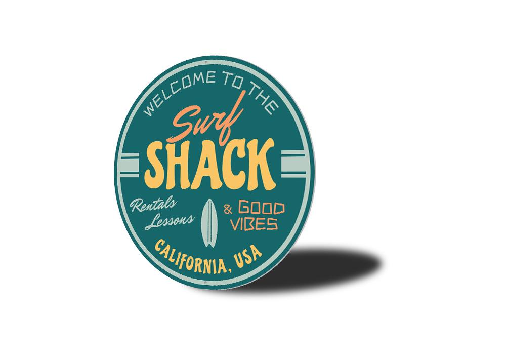 Good Vibes Surf Shack Sign made of durable aluminum, featuring vibrant colors and a beach-themed design, perfect for home decor.