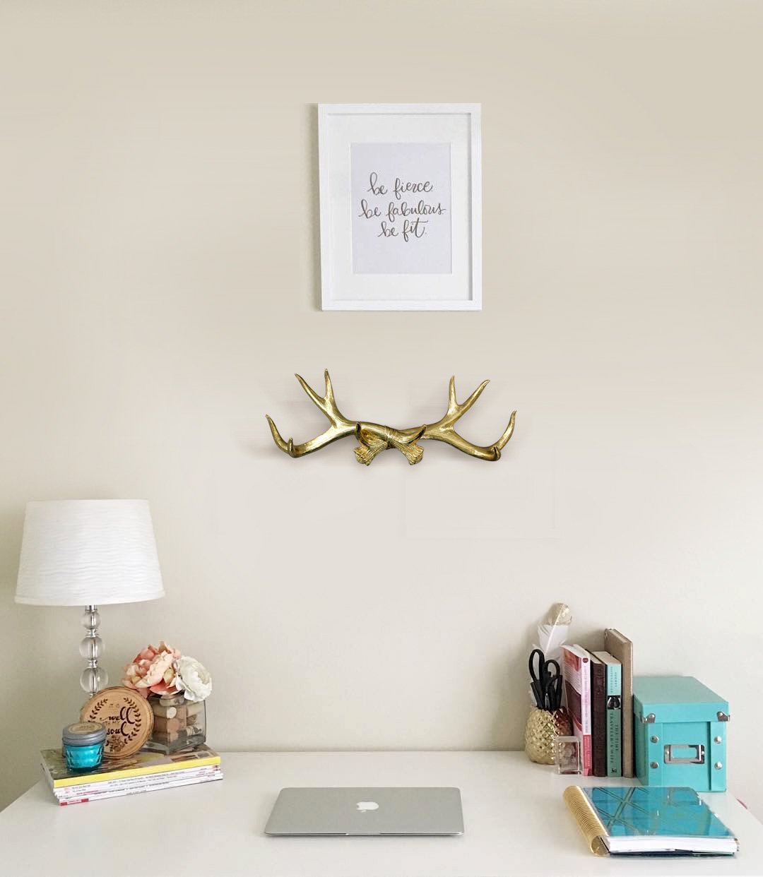 Elegant gold antler wall rack made of eco-friendly resin, perfect for hanging light items like keys and jewelry.