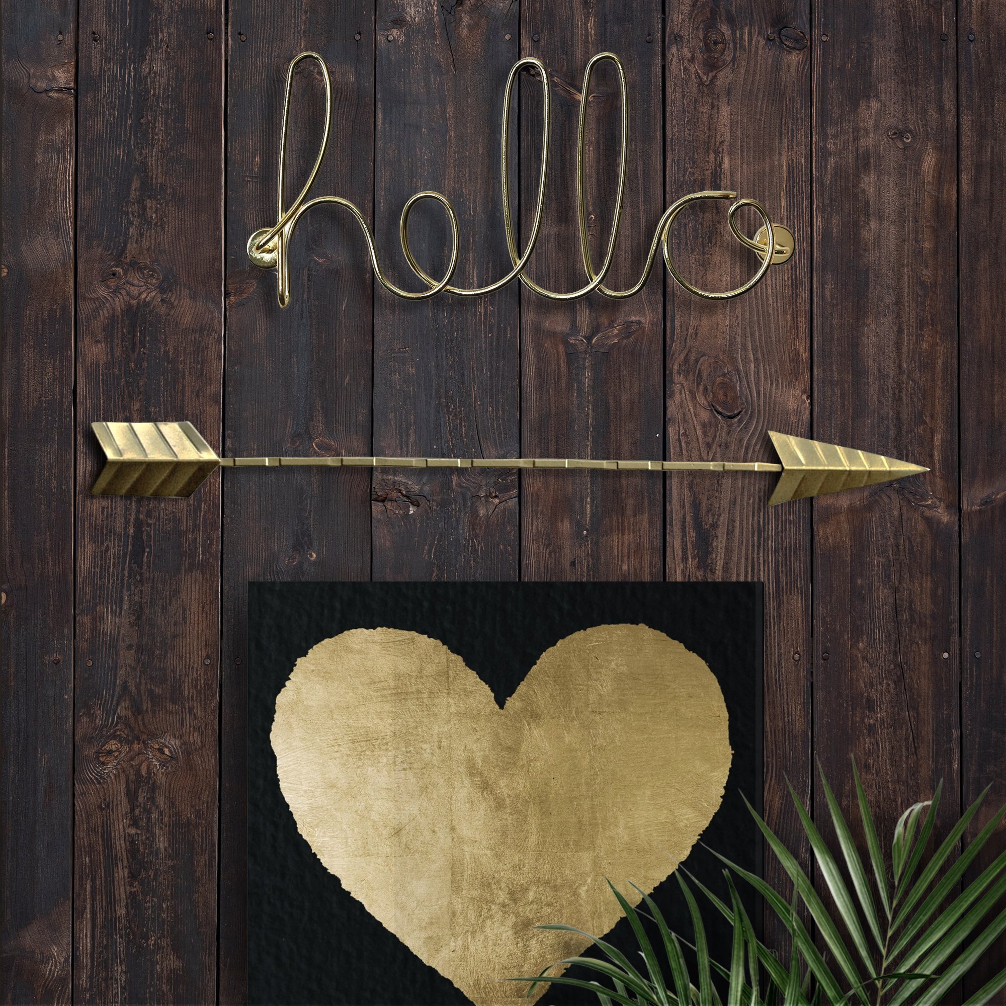 Handmade 18-inch gold cast iron arrow wall decor with dual hooks for versatile hanging.