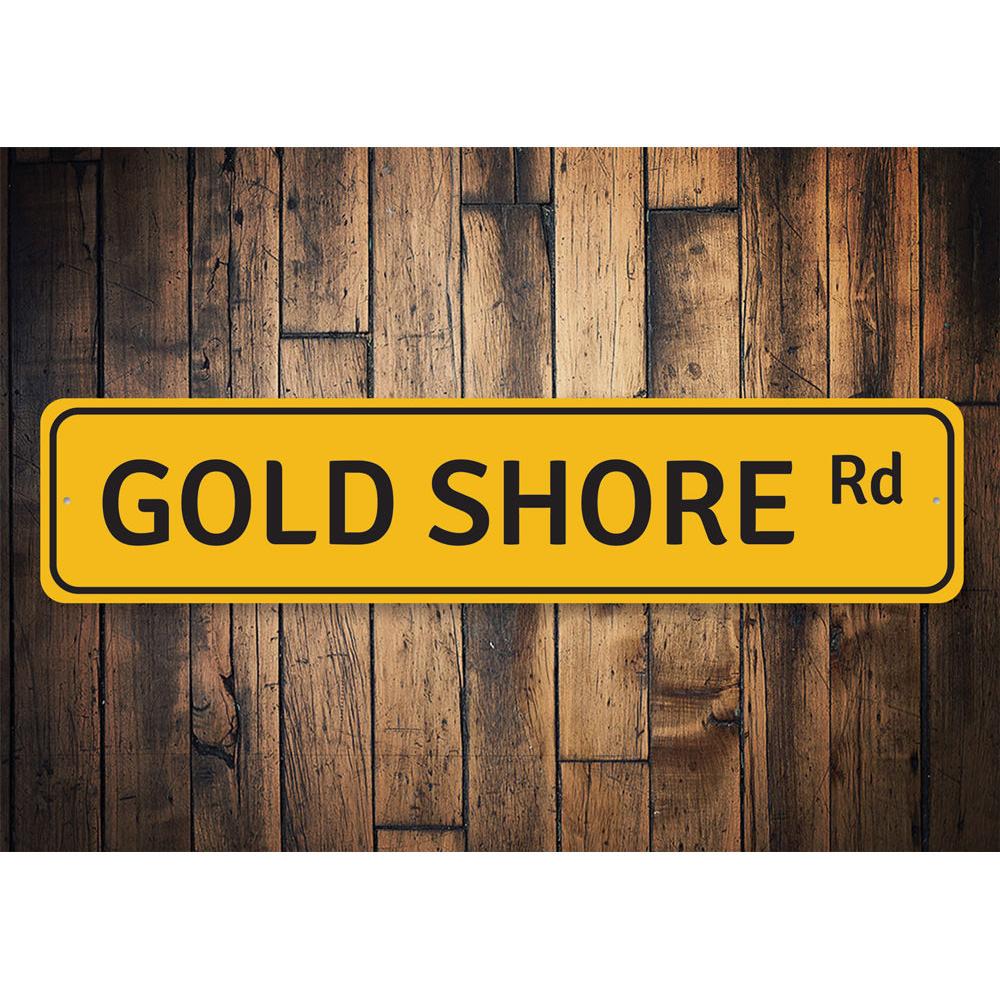 Gold Shore Road Sign made of durable aluminum, featuring a beach-themed design perfect for coastal decor.