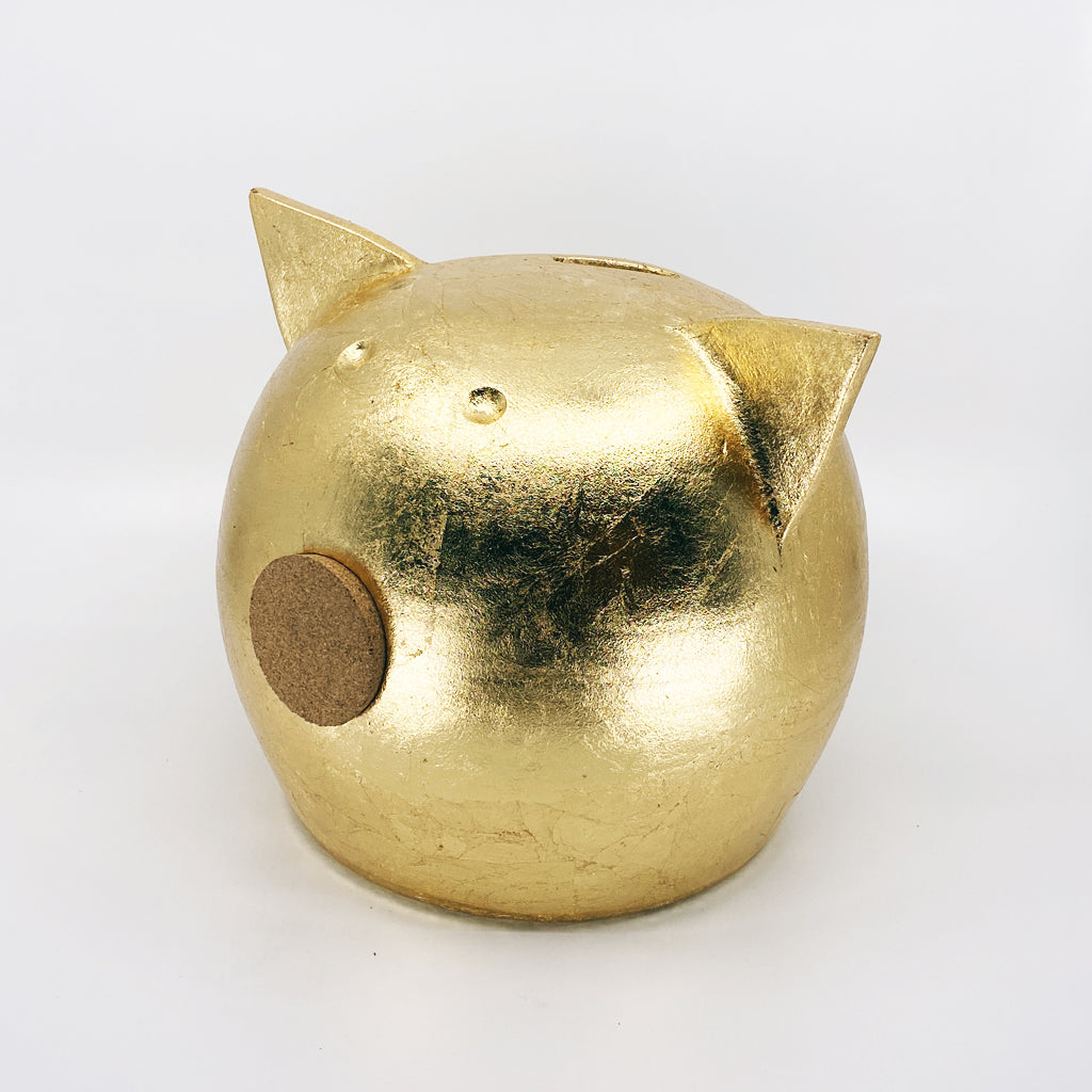 A luxurious golden piggybank from the Golden Collection, symbolizing luck and prosperity, crafted with premium golden foil.