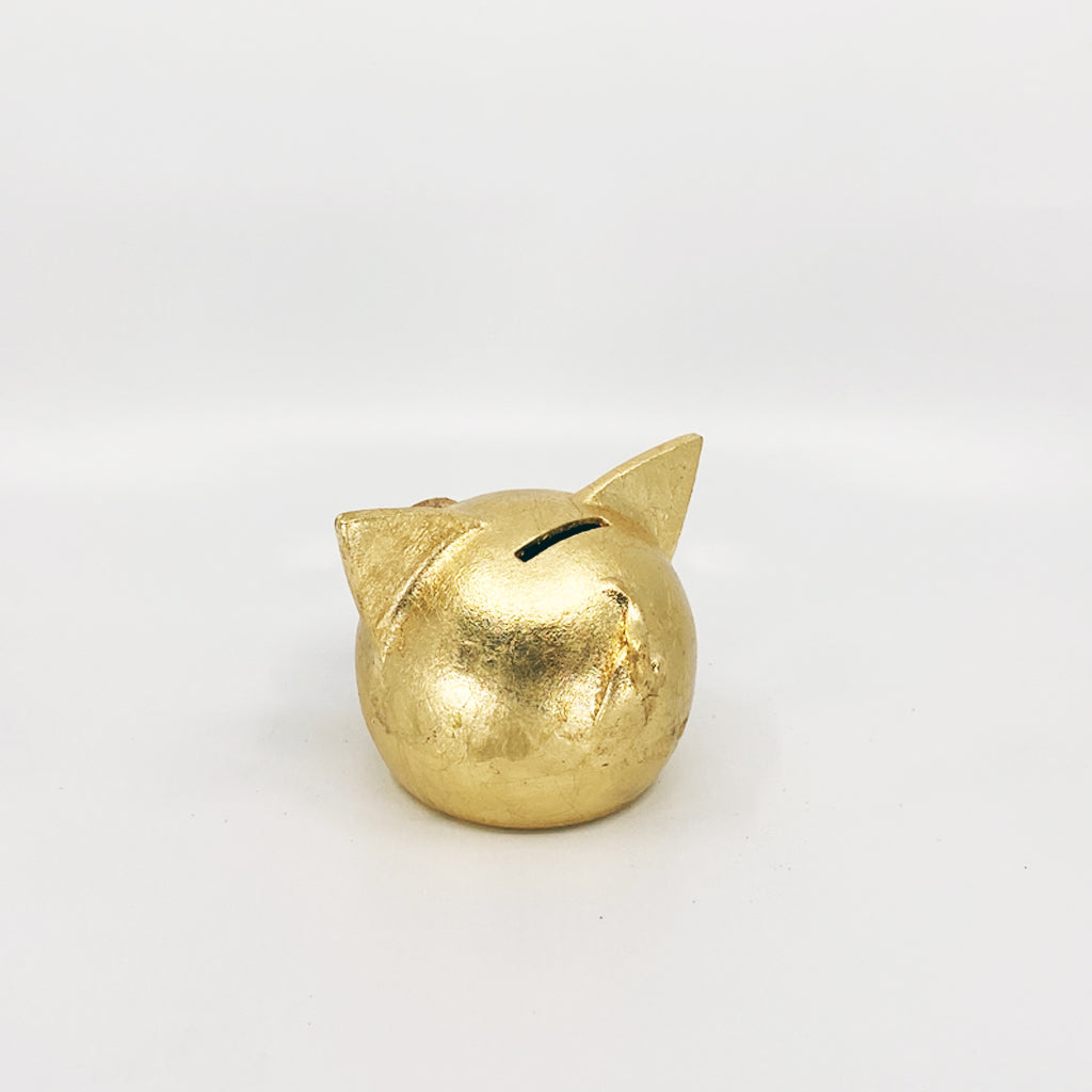 A luxurious golden piggybank from the Golden Collection, symbolizing luck and prosperity, crafted with premium golden foil.