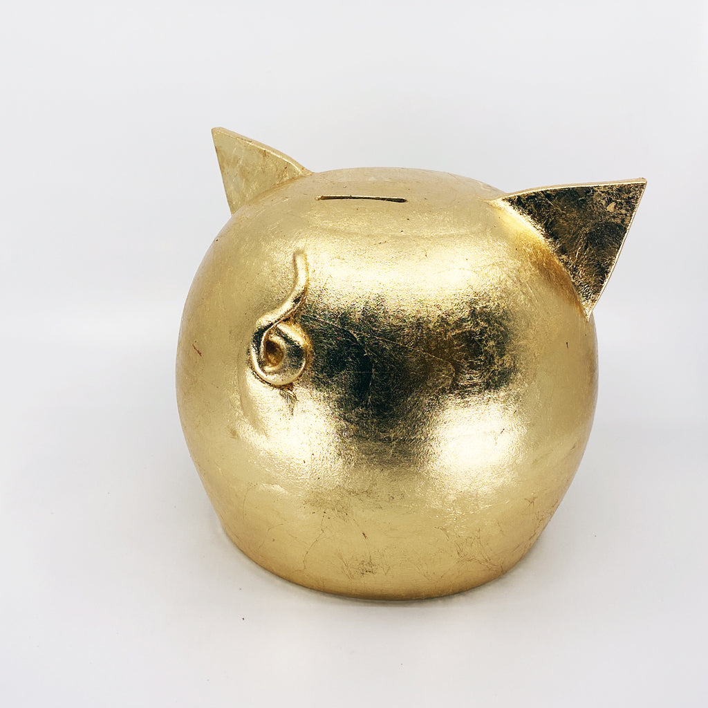 A luxurious golden piggybank from the Golden Collection, symbolizing luck and prosperity, crafted with premium golden foil.