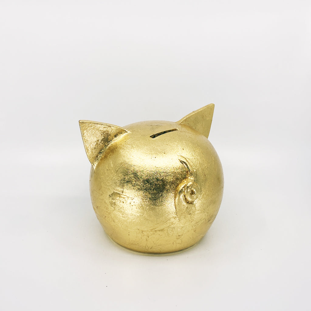 A luxurious golden piggybank from the Golden Collection, symbolizing luck and prosperity, crafted with premium golden foil.