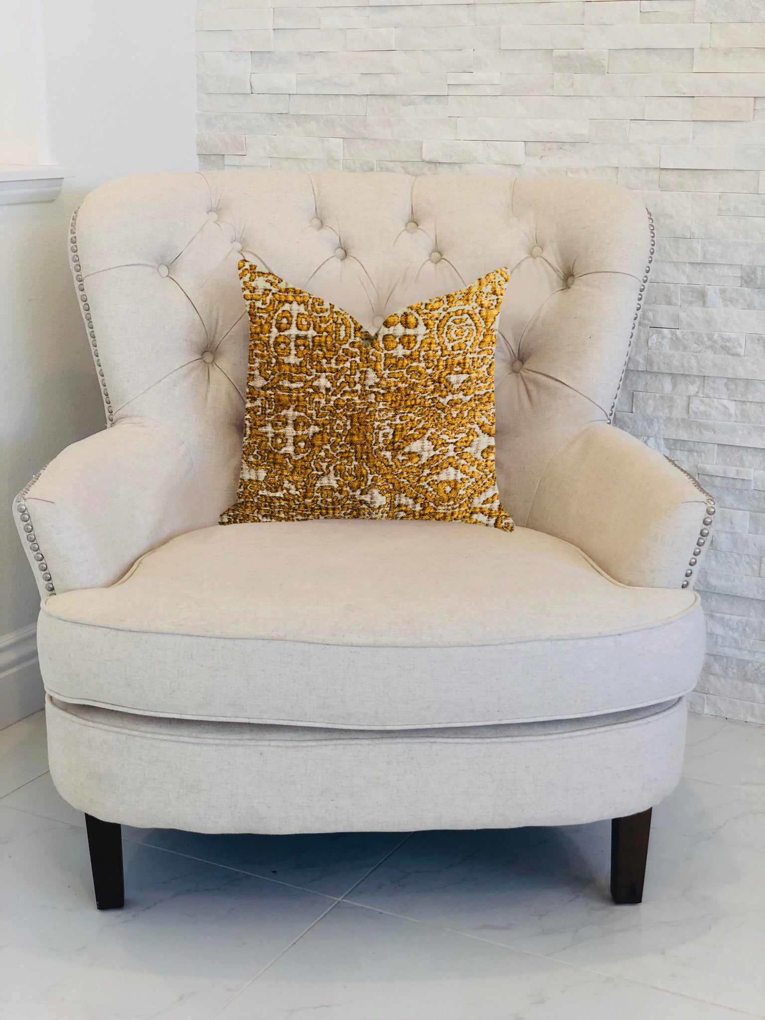 Golden Cosmo Textured Luxury Throw Pillow showcasing a rich gold and beige design, featuring a soft fabric blend and an invisible zipper.