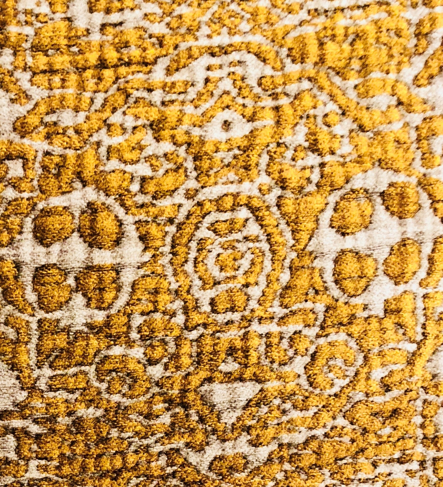 Golden Cosmo Textured Luxury Throw Pillow showcasing a rich gold and beige design, featuring a soft fabric blend and an invisible zipper.