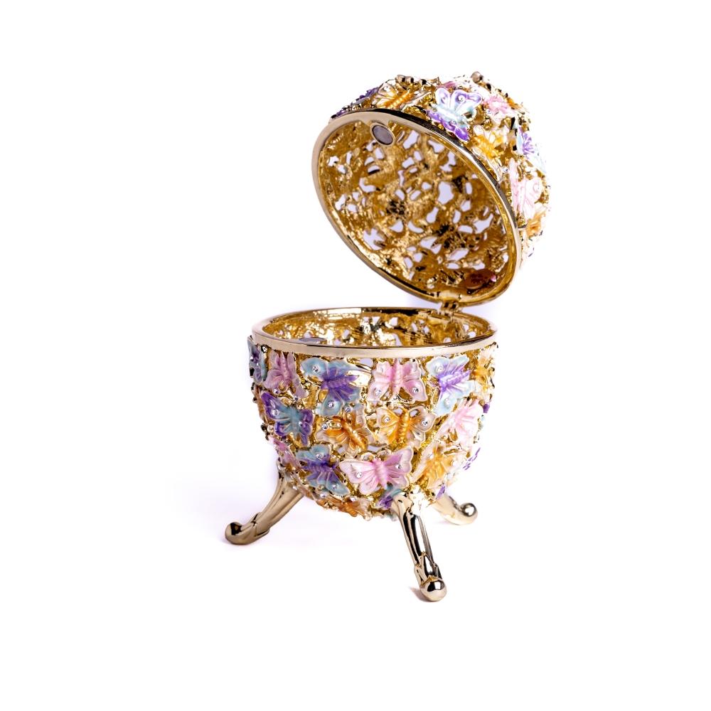 Golden Faberge Egg trinket box decorated with colorful butterflies and sparkling Austrian crystals, showcasing intricate craftsmanship.