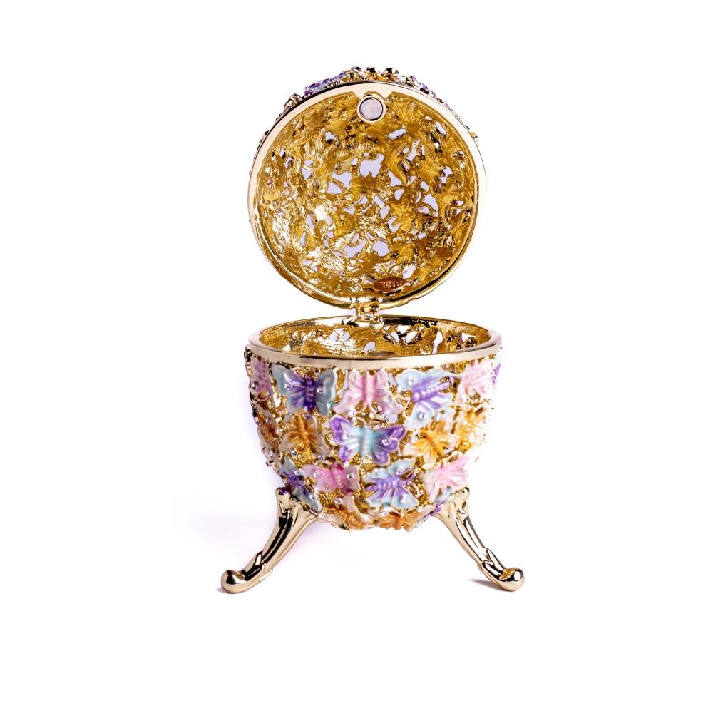 Golden Faberge Egg trinket box decorated with colorful butterflies and sparkling Austrian crystals, showcasing intricate craftsmanship.