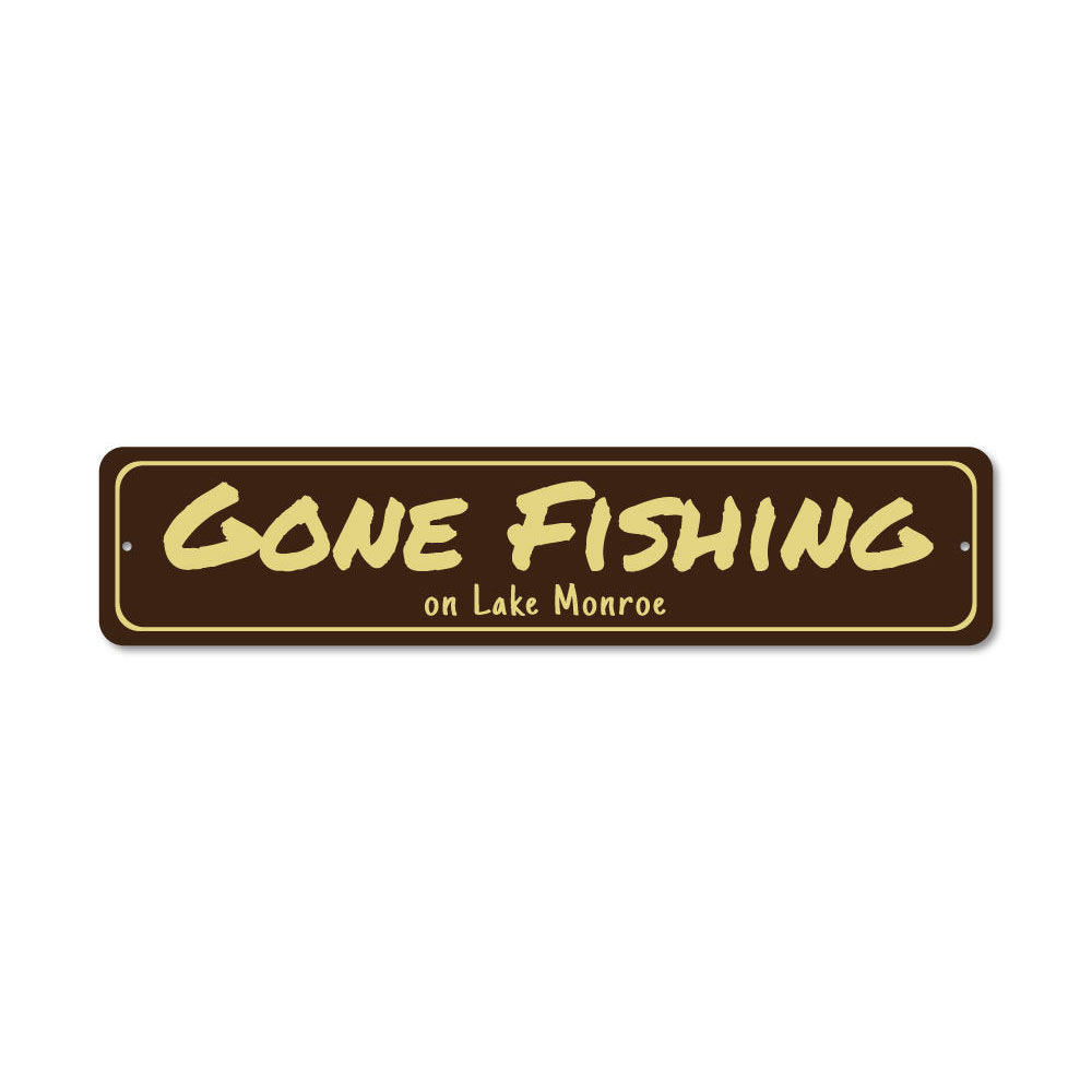 A decorative Gone Fishing sign made of durable aluminum, featuring a fishing theme, perfect for lakehouses and outdoor decor.