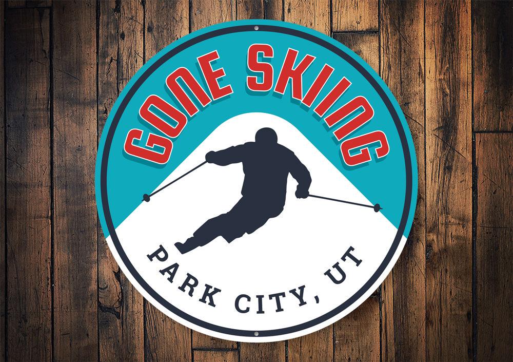 Gone Skiing Circle Sign made of high-quality aluminum, featuring a ski-themed design perfect for lodge decor.