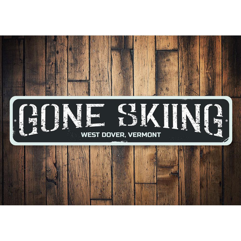 Gone Skiing Sign made of high-quality aluminum, featuring a ski-themed design, perfect for home decor.