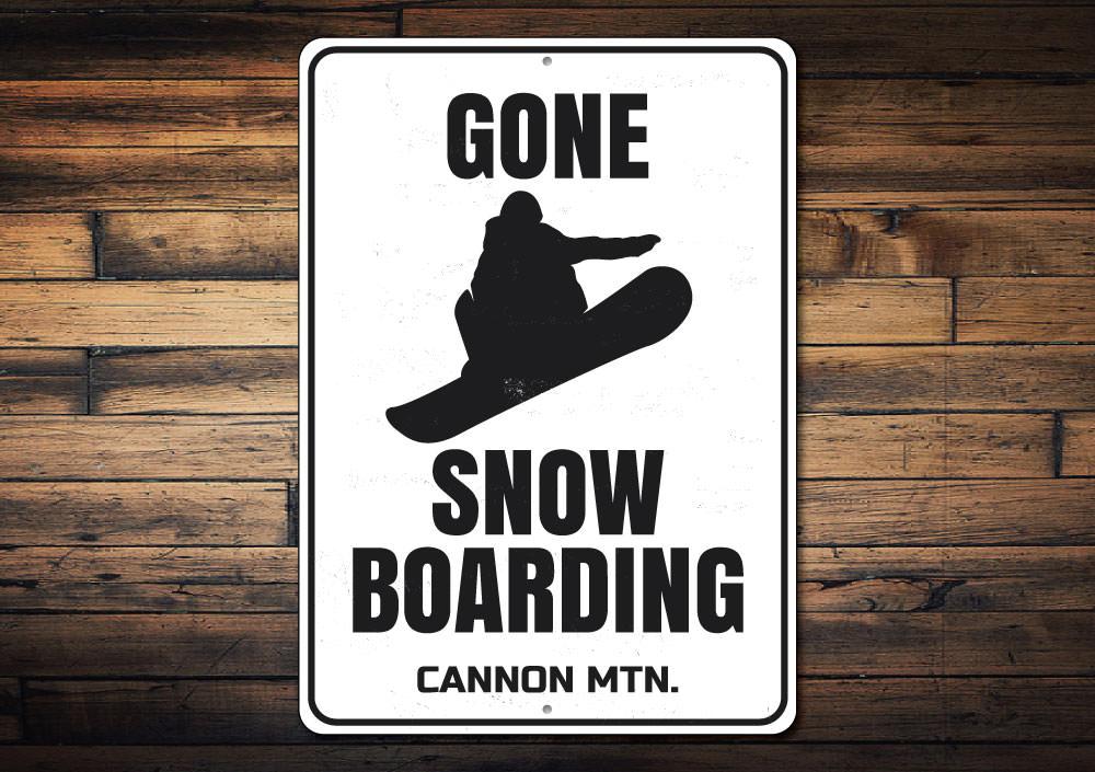 Gone Snowboarding decorative sign made of aluminum, featuring a stylish design perfect for snowboarding enthusiasts.