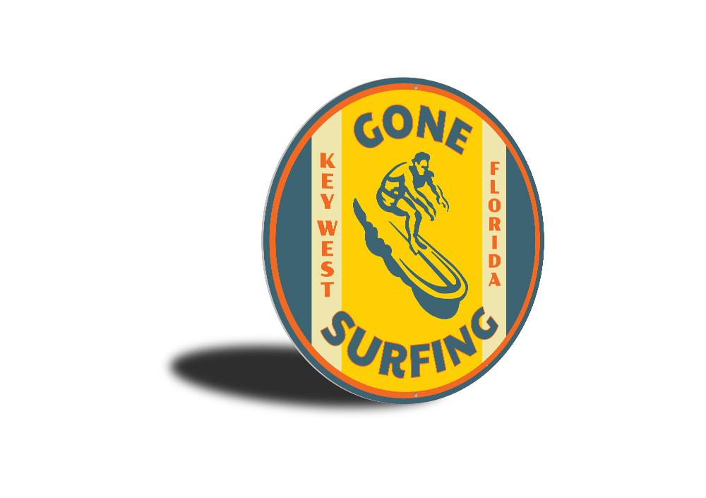 Gone Surfing Key West Florida decorative sign made of aluminum, featuring vibrant colors and a beach-themed design, perfect for coastal decor.