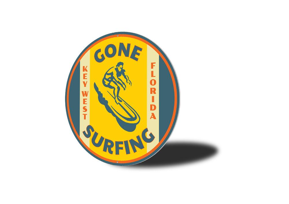 Gone Surfing Key West Florida decorative sign made of aluminum, featuring vibrant colors and a beach-themed design, perfect for coastal decor.