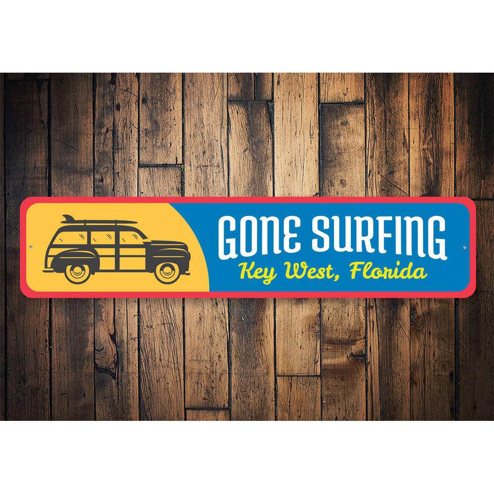 Gone Surfing Key West Sign made of high-quality aluminum, featuring vibrant colors and a beach-themed design, perfect for coastal decor.