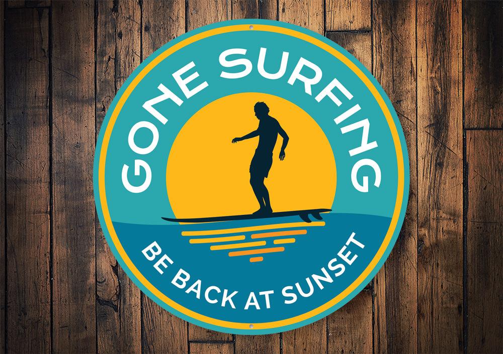 Gone Surfing Sunset Sign featuring vibrant colors and beach-themed design, perfect for coastal decor.