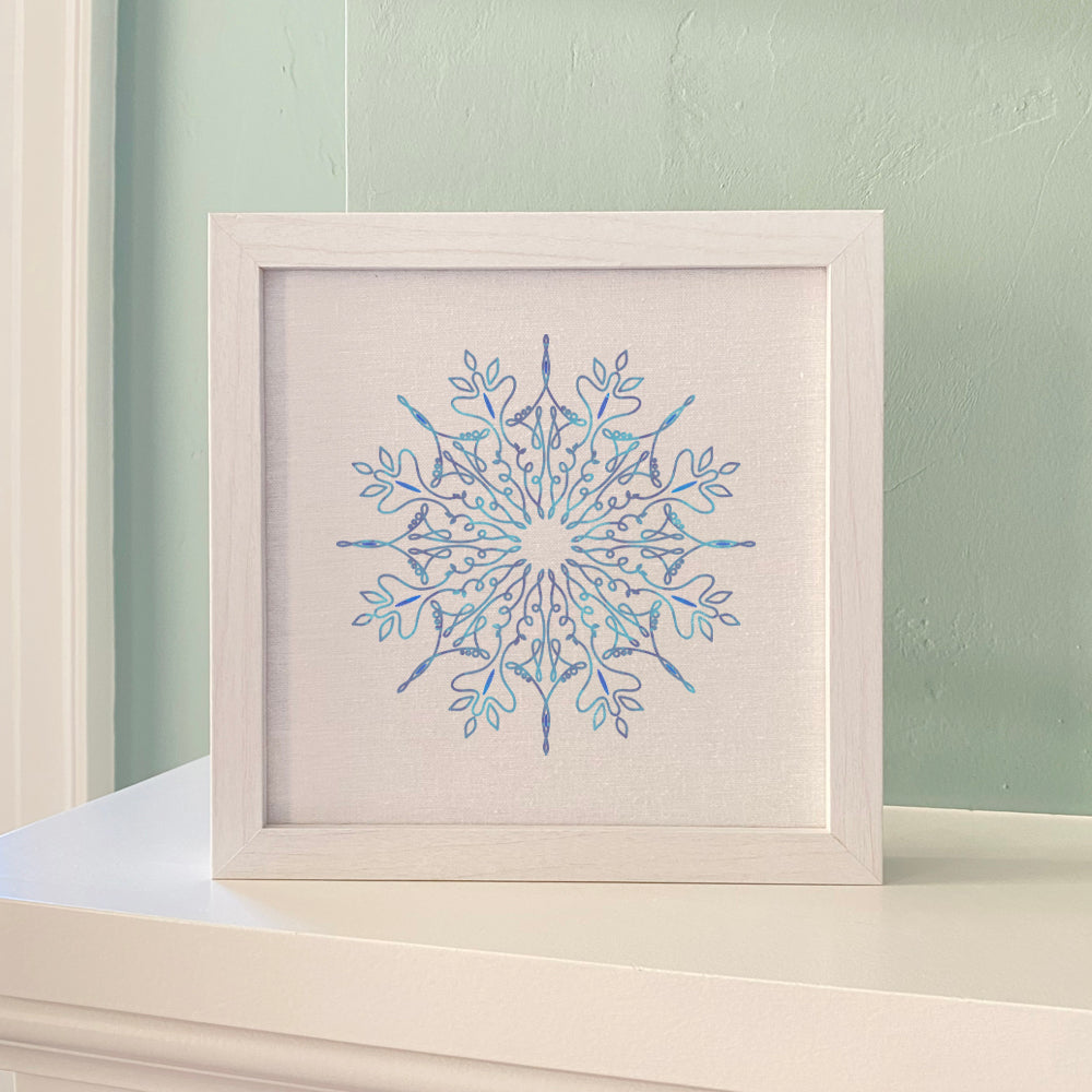 Gradient Snowflake Framed Sign with a wood frame, eco-friendly ink printing on a linen-look background.