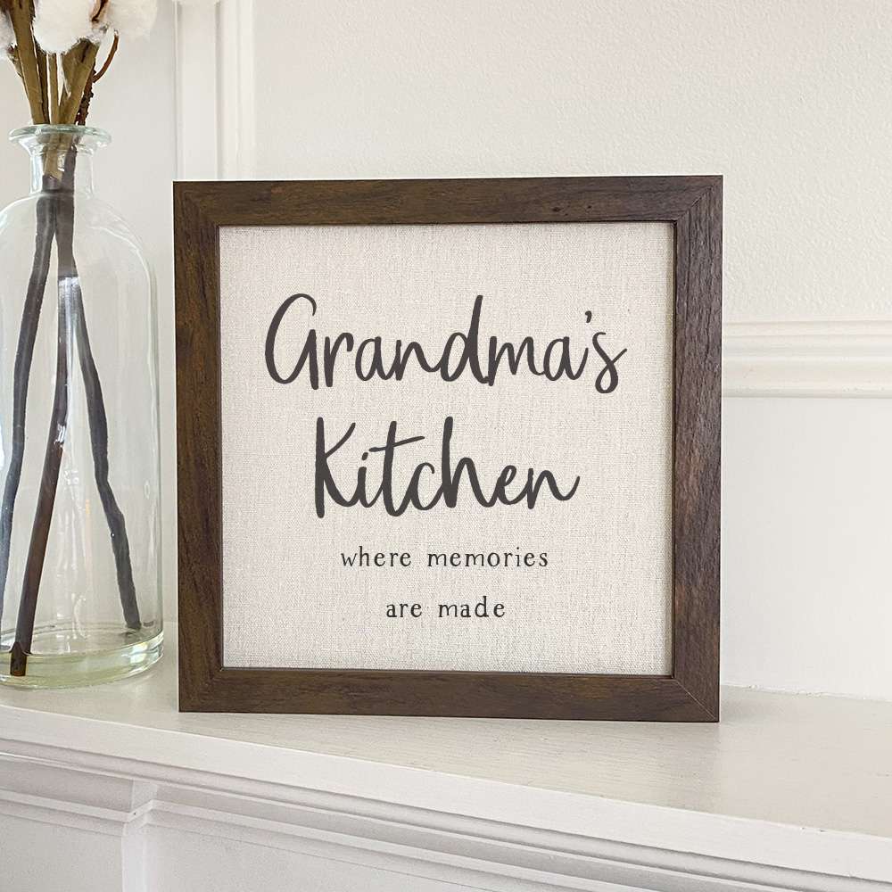 Grandma's Kitchen framed sign with a wood frame, featuring a linen-look background and eco-friendly printing.