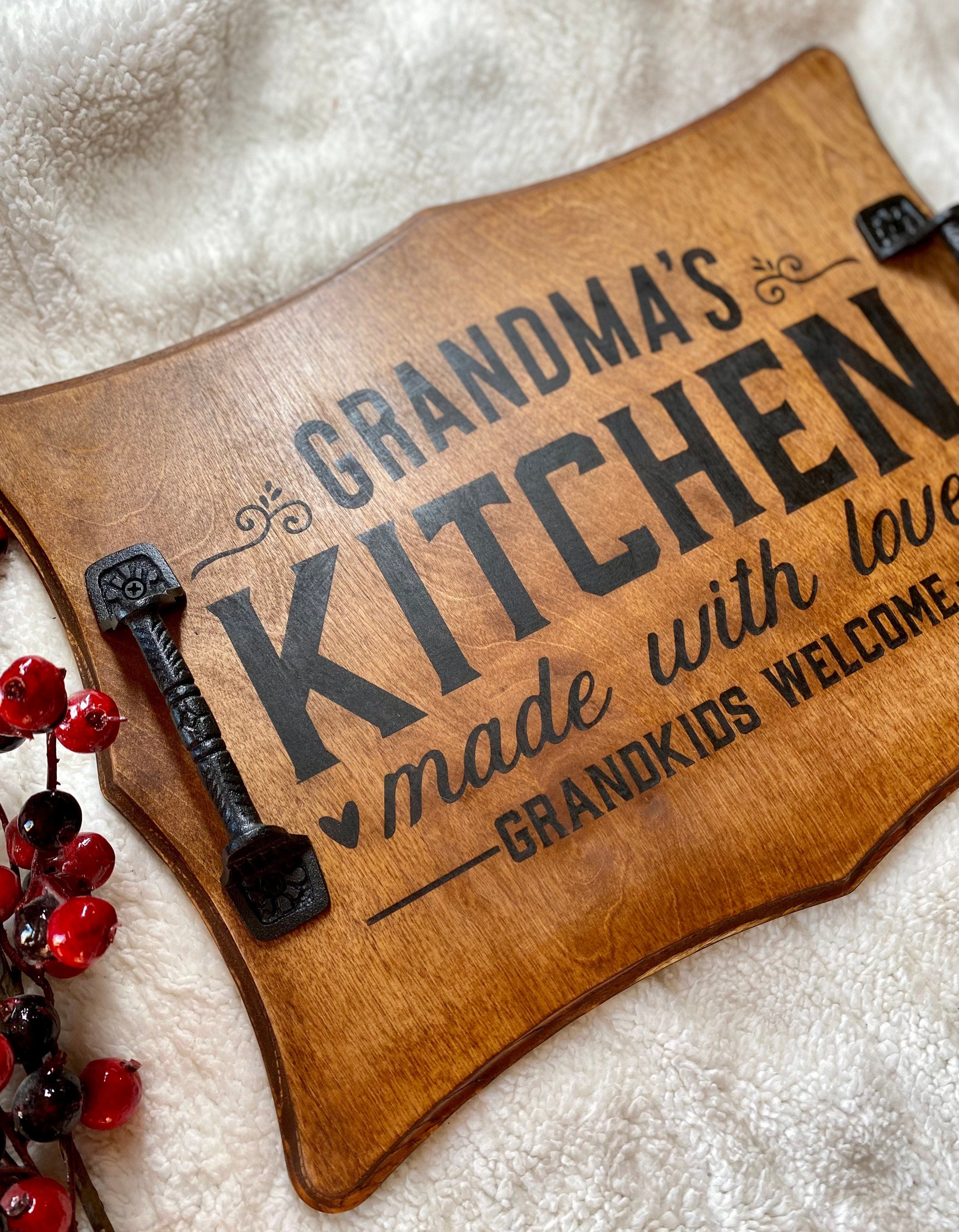 Handmade wooden serving tray with cast iron handles, stained in rich chestnut color, featuring a unique burned design.